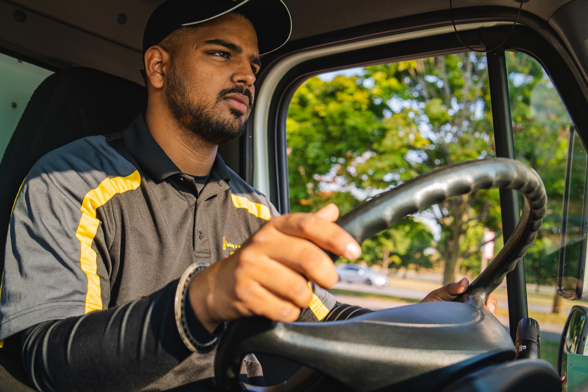 Courier driving delivery vehicle.